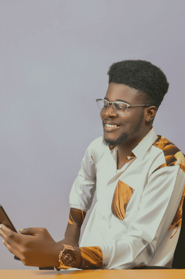Online vendor smiling at phone