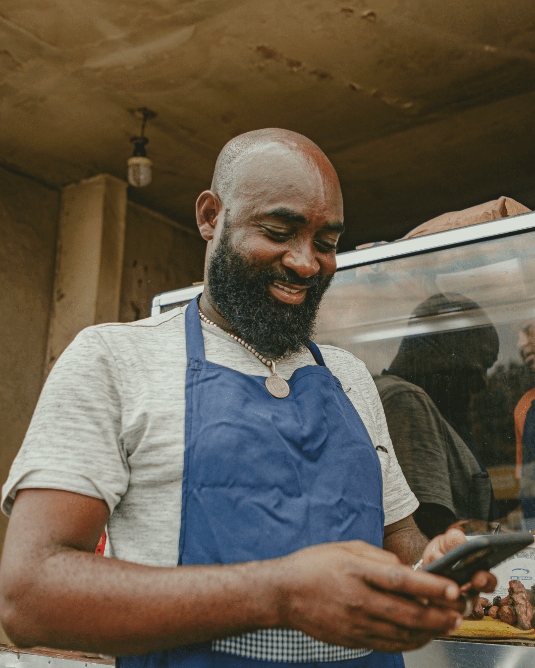Man smiling at phone